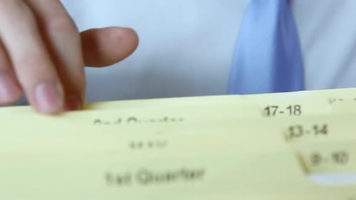 Office worker filing document