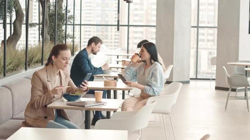 People Having Lunch at Food Court with Panoramic Windows