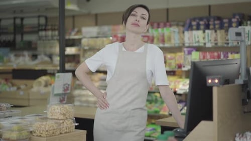 Woman Retail Worker Standing Behind Store Counter Smiling