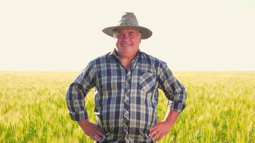 Friendly Male Farmer in Cereal Field