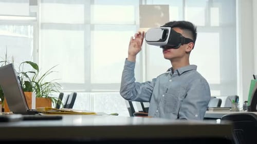 Man Using VR Headset in Modern Office