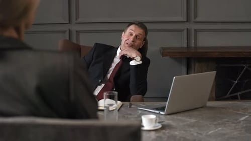 Male CEO Conducting Job Interview with Female Candidate