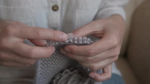 Hands Knitting Cozy Grey Wool Fabric