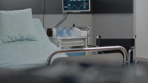 Close Up of Empty Hospital Ward Bed with Medical Equipment