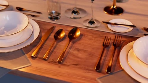 Elegant tableware at the restaurant. Dinner set at the reception. Candles light.