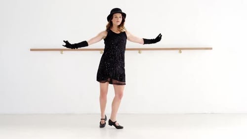 Woman Tap Dancing in Black Dress and Hat