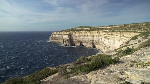 Panoramic View of Mediterranean Sea and Cliffs of Gozo Island on Windy Day