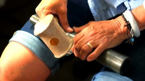 Woman Hammers Metal Bracelet in Close Up