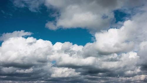 Time Lapse of Puffy White Clouds and Blue Sky