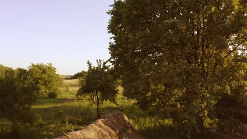 View From a Drone Rising and Flying Upon Field