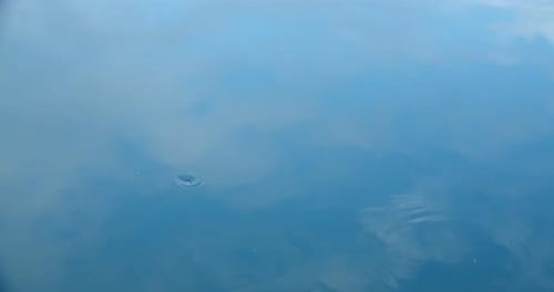 Gentle Water Ripples Reflecting the Sky