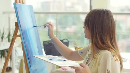 Art, Creativity, Hobby, Job and Creative Occupation Concept. Young Cute Girl Draws in Art Workshop