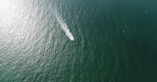 Aerial view of speed boats on the sea near beach city