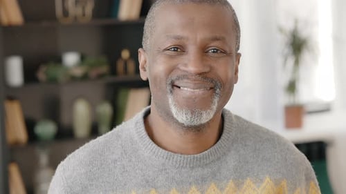 Smiling Man with Gray Hair Indoors