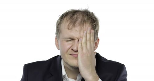 Man Massages Temples Due To Headache and Stress