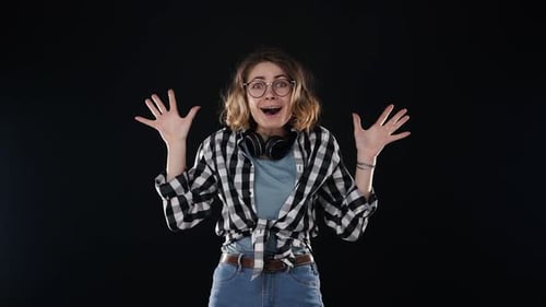 Woman Expressing Extreme Surprise and Excitement in Studio
