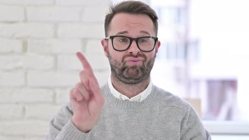 Man Shakes Finger To Express No