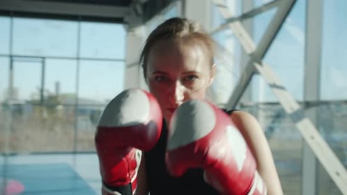 Female Boxer Practicing Punches at the Gym