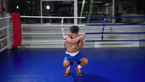 Young Boxer is Training Alone in Ring Jumping with Skipping Rope ...