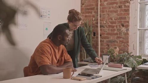 Colleagues Working Together in a Modern Office