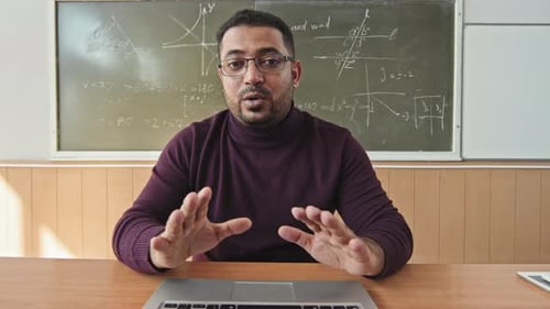 Teacher Explaining Math Concepts in Classroom