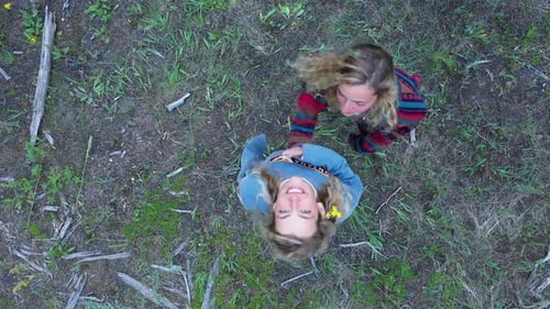 Aerial View of Women Waving in Nature