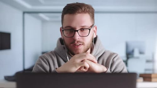 Man at Office Having Videochat