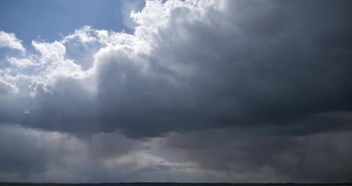 Storm Clouds Rolling Across Open Sky