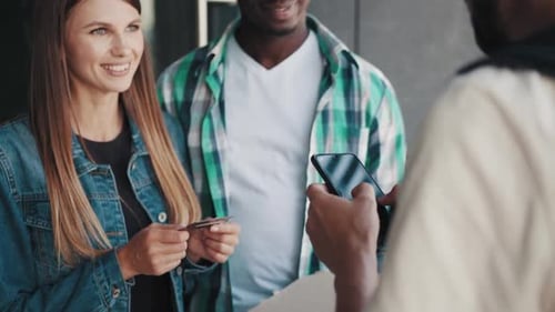 Friendly Delivery Worker Delivering Pizza to Customers