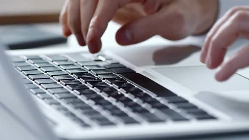 Fingers Typing on Laptop Keyboard Close Up