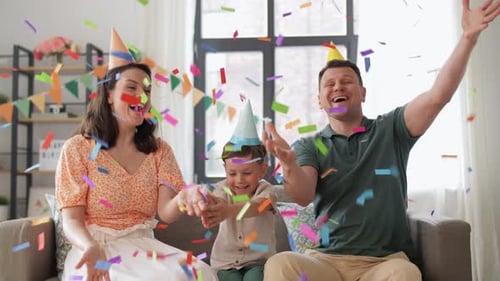 Happy Family Celebrating Birthday Throwing Confetti