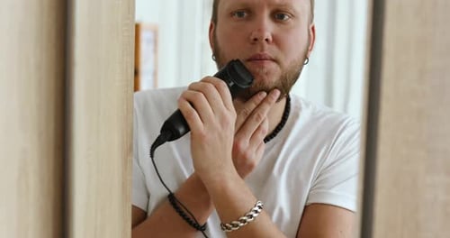 Young Adult Grooming Beard with Electric Trimmer