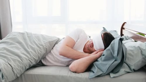 Man Sleeping in the Bed