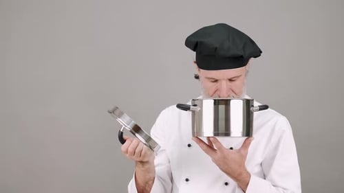 Chef Tastes Food From Cooking Pot