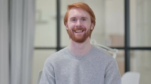 Portrait of Young Redhead Man Smiling at Camera