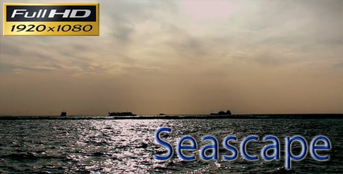 Sunset Over the Calm Ocean with Boats