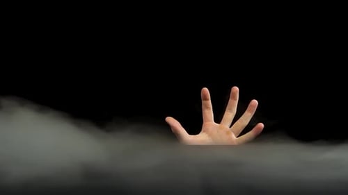 Hand Gesturing from Ethereal Smoke on Black Background