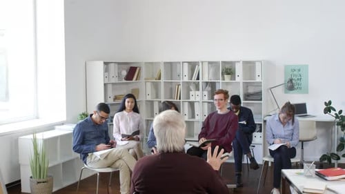 Adults in Training Session in Bright Modern Office