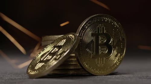 Cryptocurrency on the block chain - close up of bitcoin altcoin physical coins in dynamic setting