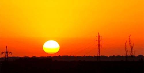 Sunrise Time Lapse over Countryside with Electrical Towers