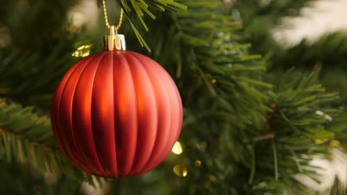 Close-up of Christmas ornament in red color 4K 2160p 30fps UltraHD footage - Glass bauble on the ar