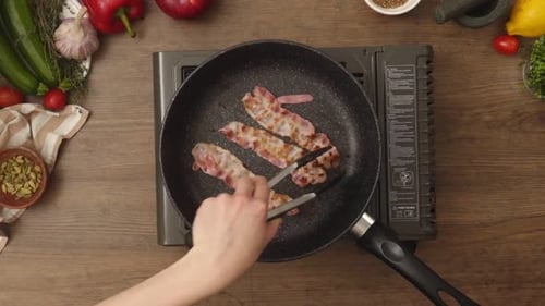 Frying Crispy Bacon Strips in a Pan