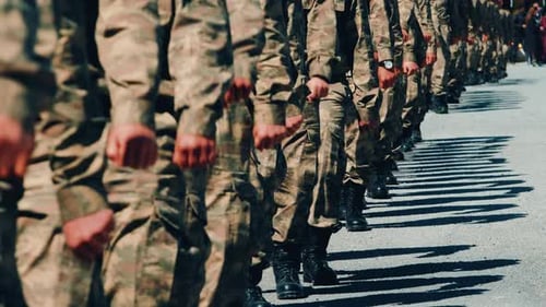 Soldiers Marching in Precise Formation on Street