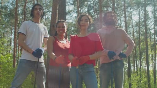 Charity Eco Activists with Tools Posing in Forest