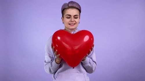 Positive Woman Sharing Tenderness Love Giving Balloon Close to Camera