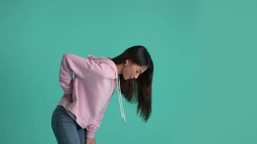 Young Woman Experiencing Back Pain