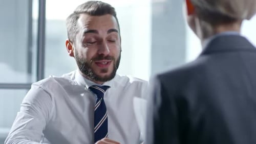 Young Manager Speaking with Female Employee