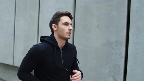 Close Up Sportsman Running Outdoor. Handsome Guy Running Upstairs in Slow Motion