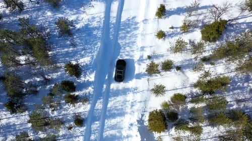 Black Suv Car Driving In Winter Snow Country Road 2