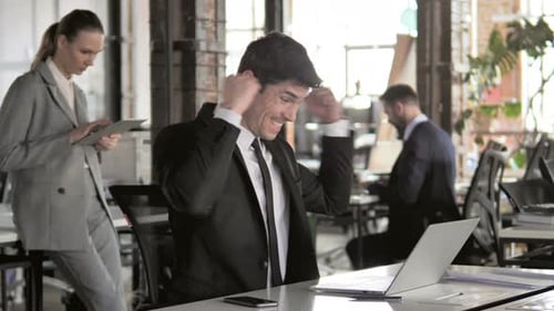 Team Celebrates Achievement in Modern Office Environment